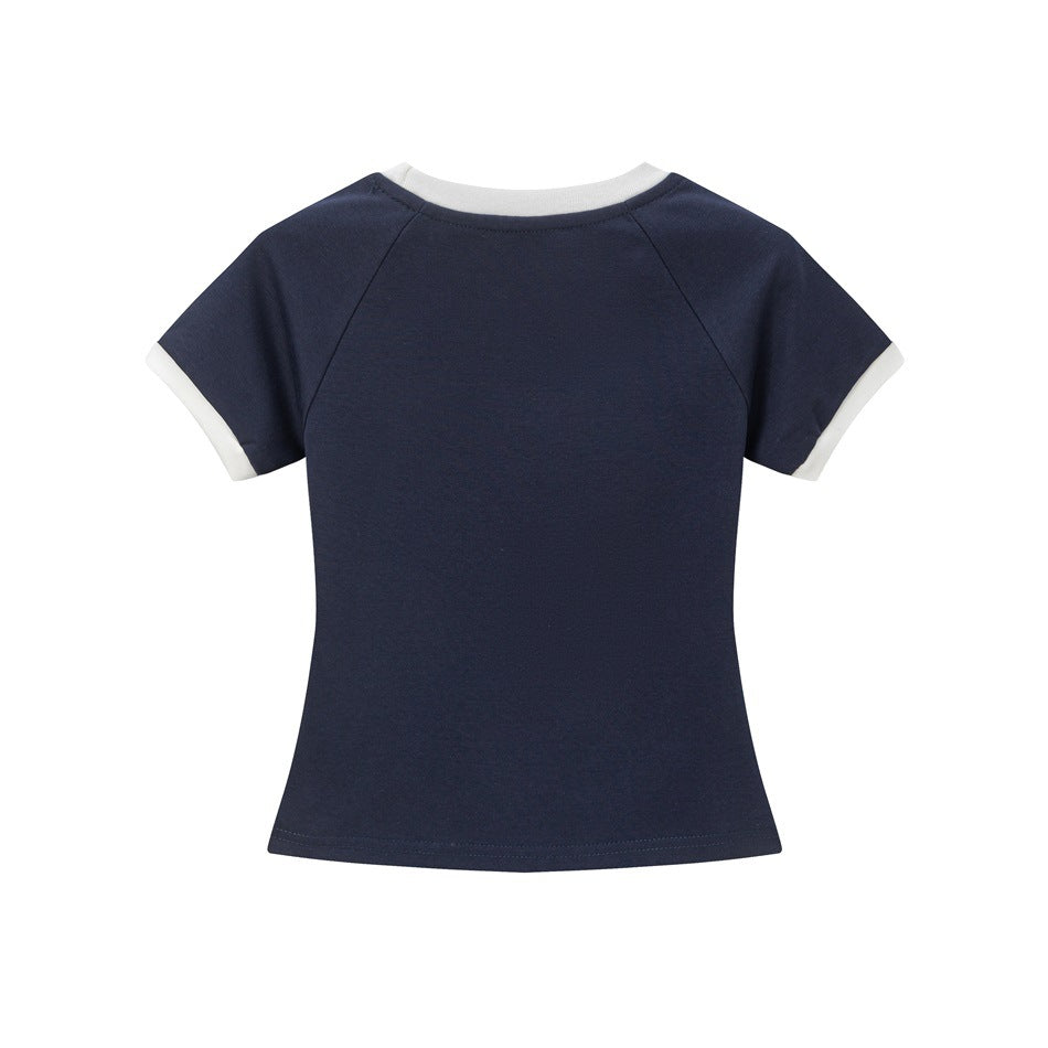 Back view of plain navy cropped T-shirt with white neckline and sleeve cuff trim