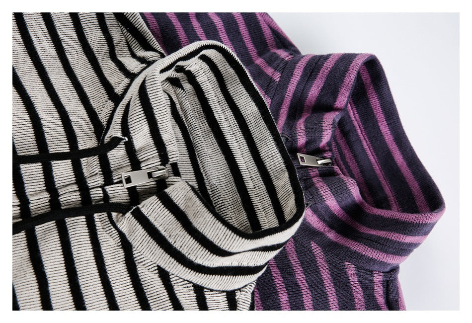 Close-up of striped high collars and zippers on purple and navy, and cream and black versions of the garment.