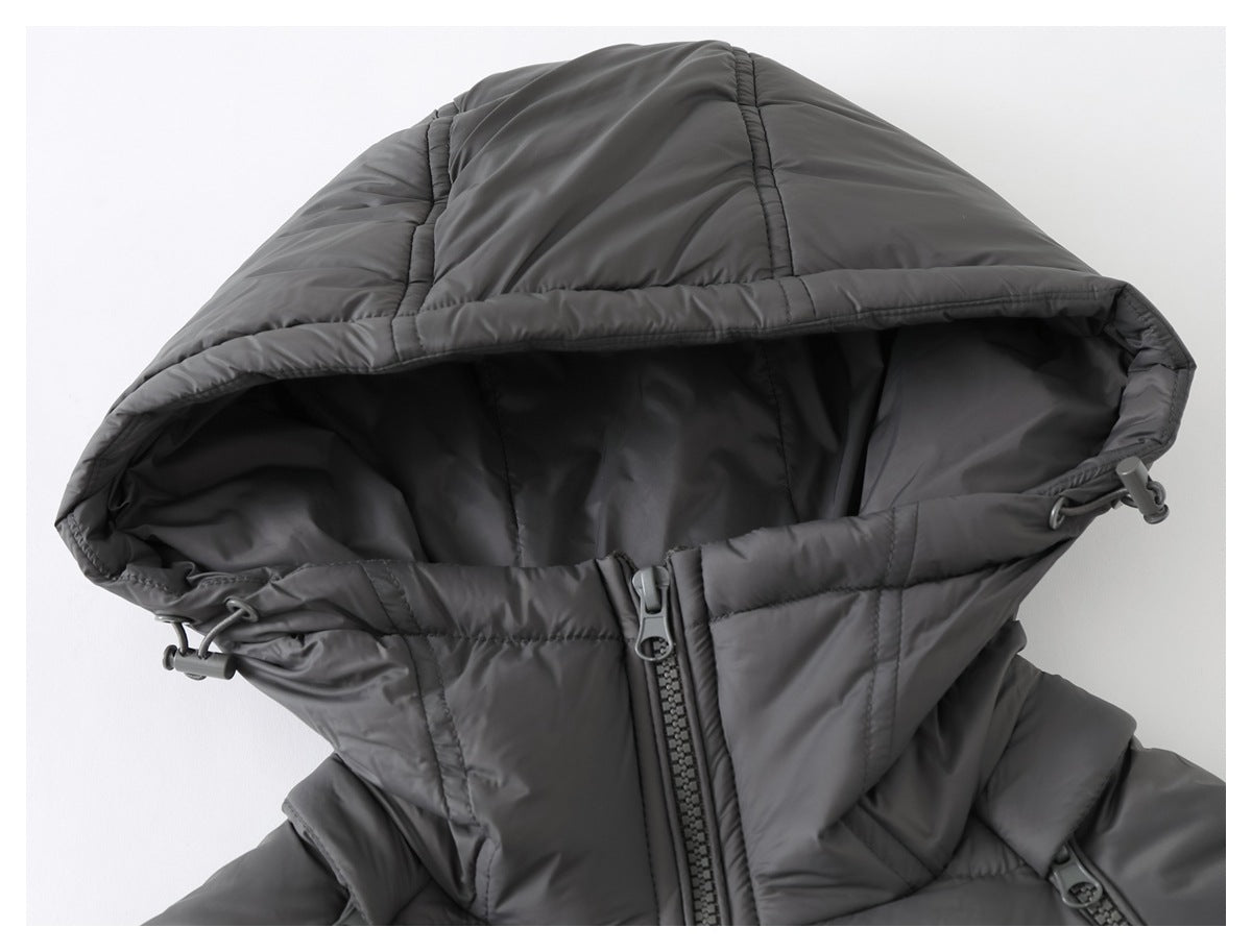 Close-up of a charcoal quilted jacket hood with drawcord toggles and a front zipper.