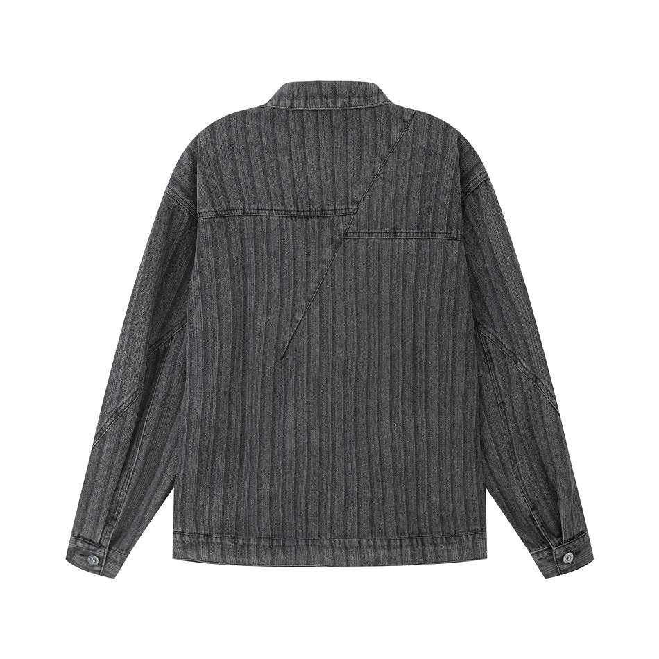 Back view of a charcoal-gray denim jacket with fine vertical stripes and an angular seam across the upper back.