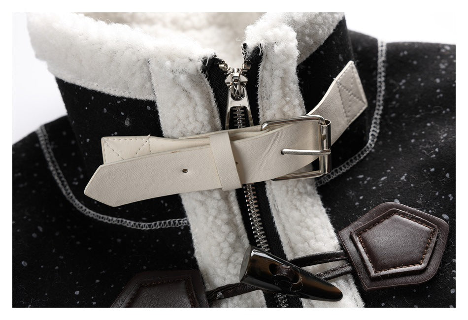 Close-up of the jacket collar with a white buckle strap, zipper, and dark toggle closures.