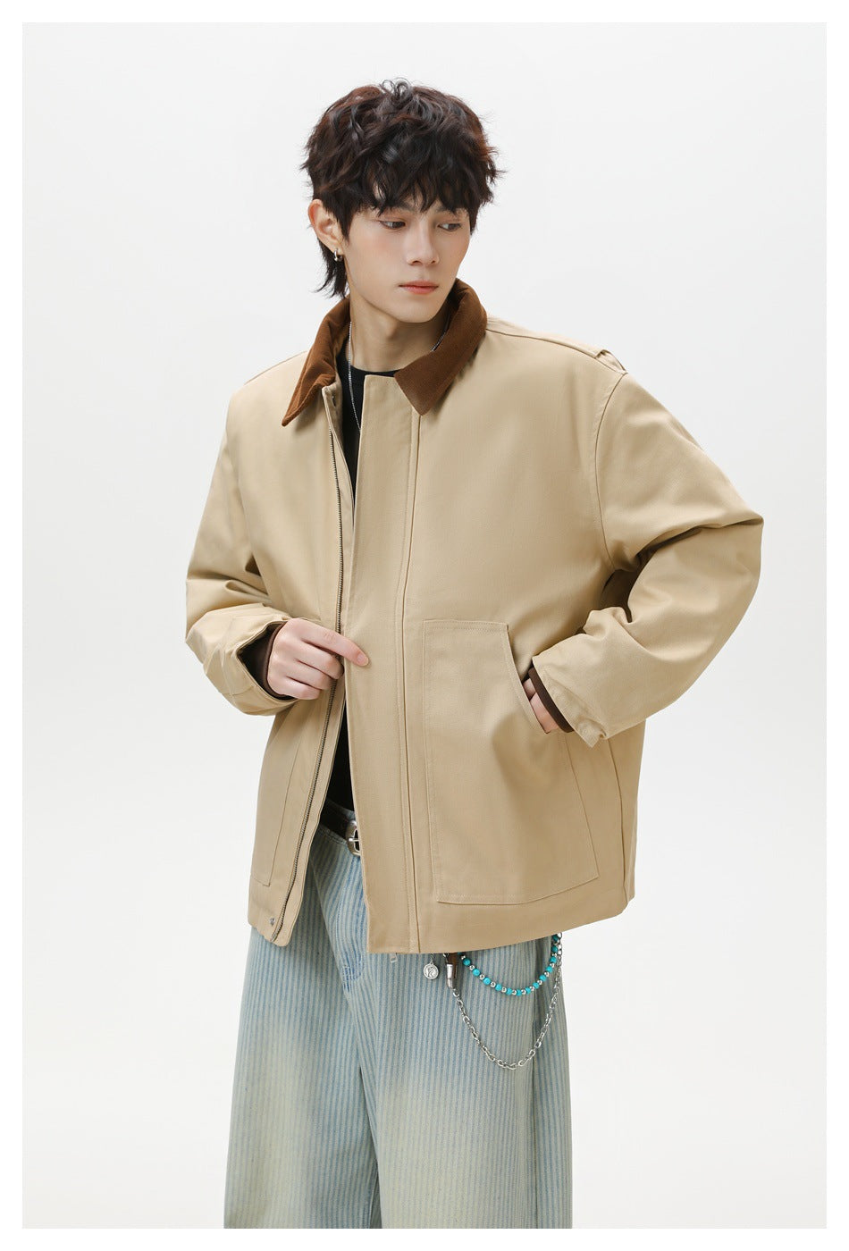 Model wearing a beige jacket with a brown corduroy collar, zip front and large patch pockets.