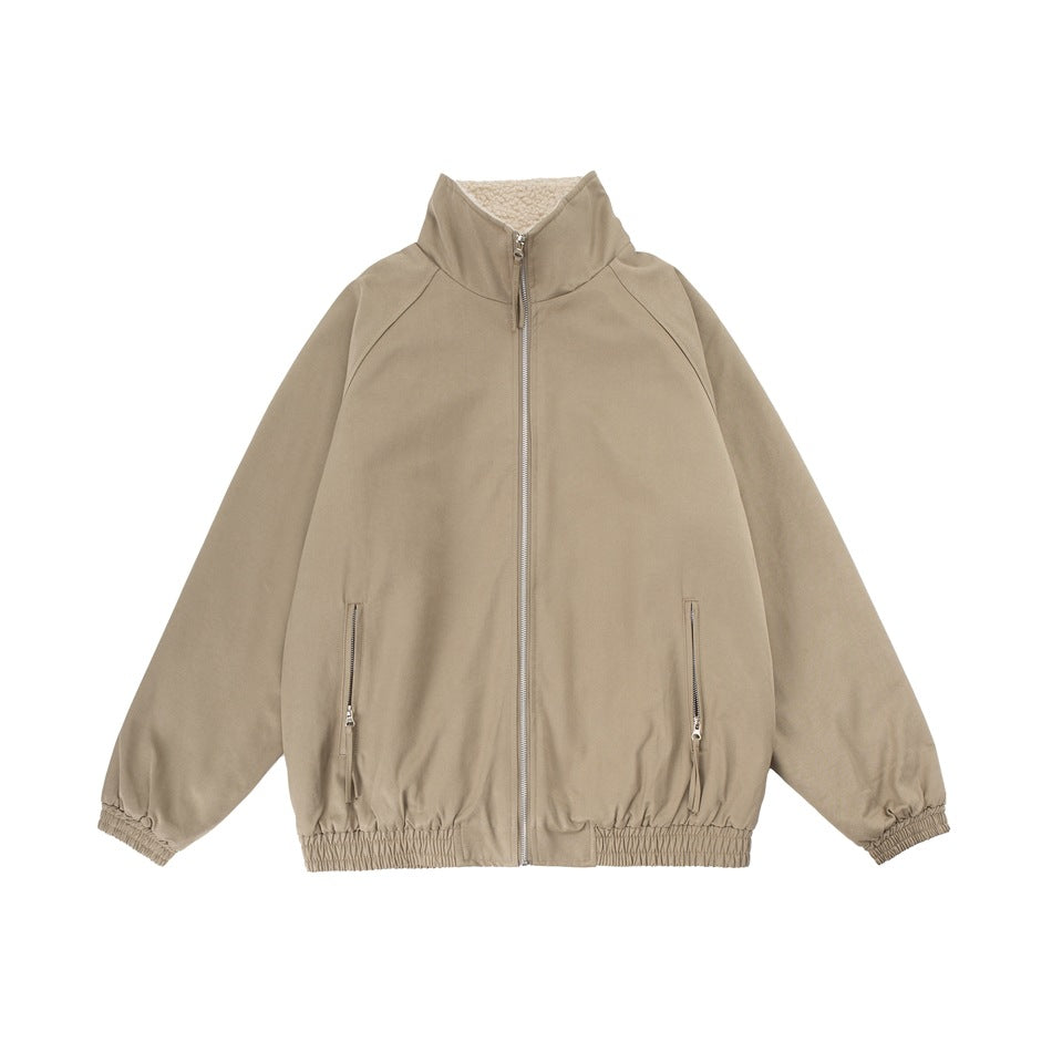 Front view of a taupe zip-up jacket with a high collar, fleece lining, zip pockets, and elasticated cuffs and hem.