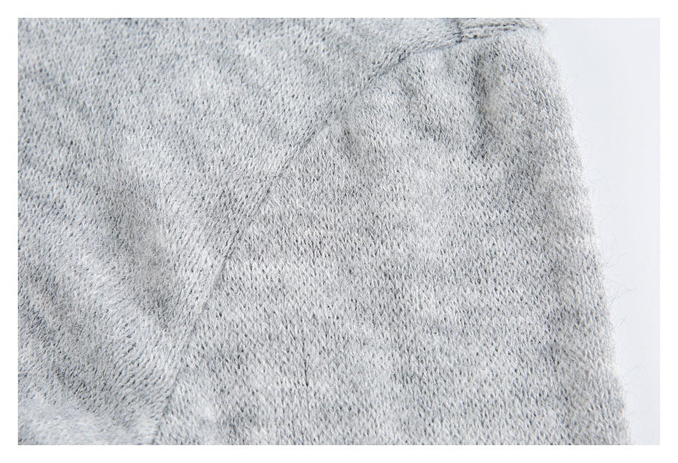 Close-up showing the soft-looking knit texture of a light gray garment.