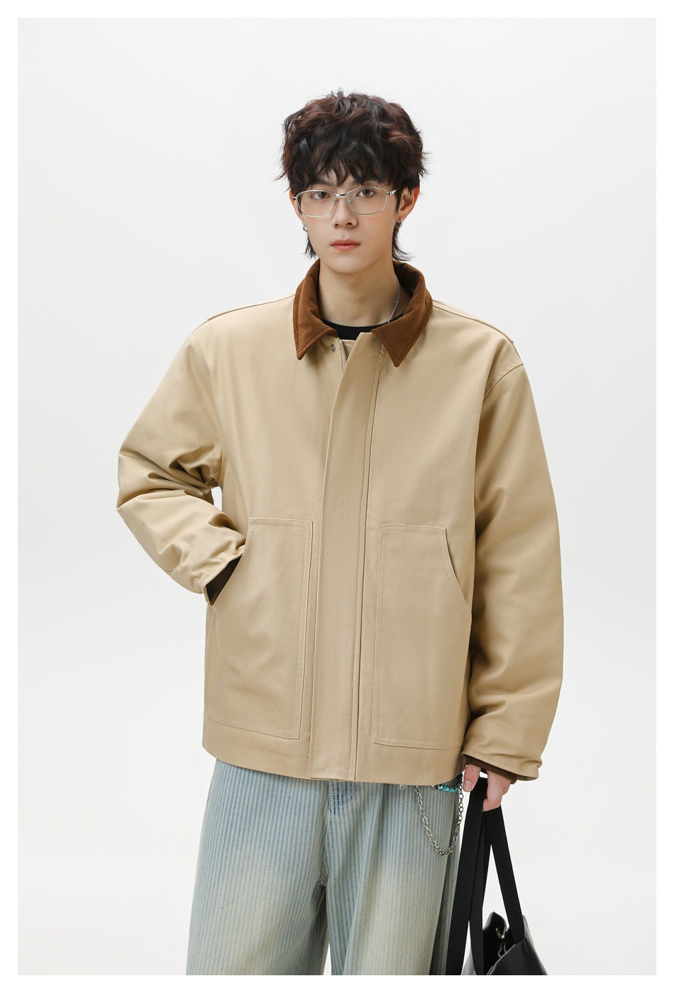 Front view of a model wearing a beige jacket with a brown collar and two large patch pockets.