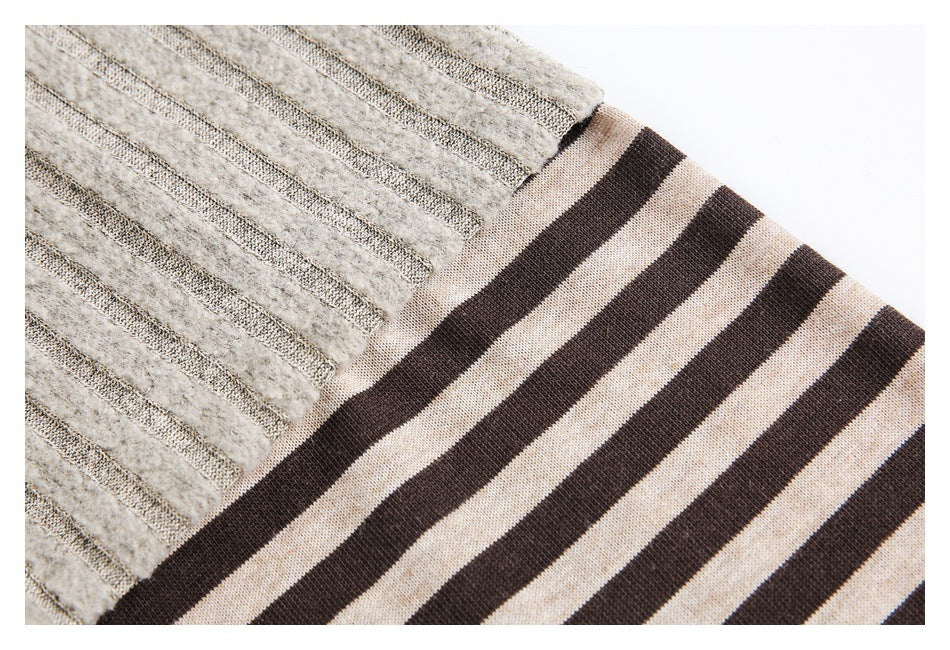 Close-up of beige fuzzy ribbed knit meeting a brown and beige striped knit section.