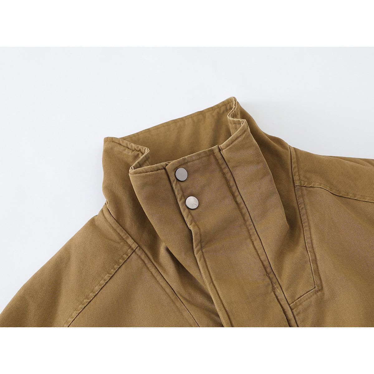 Close-up of a tan jacket collar with a snap-button storm flap and visible stitching.
