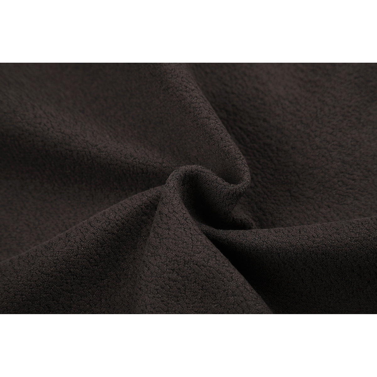 Close-up showing the dark brown jacket fabric's textured surface and a folded edge.