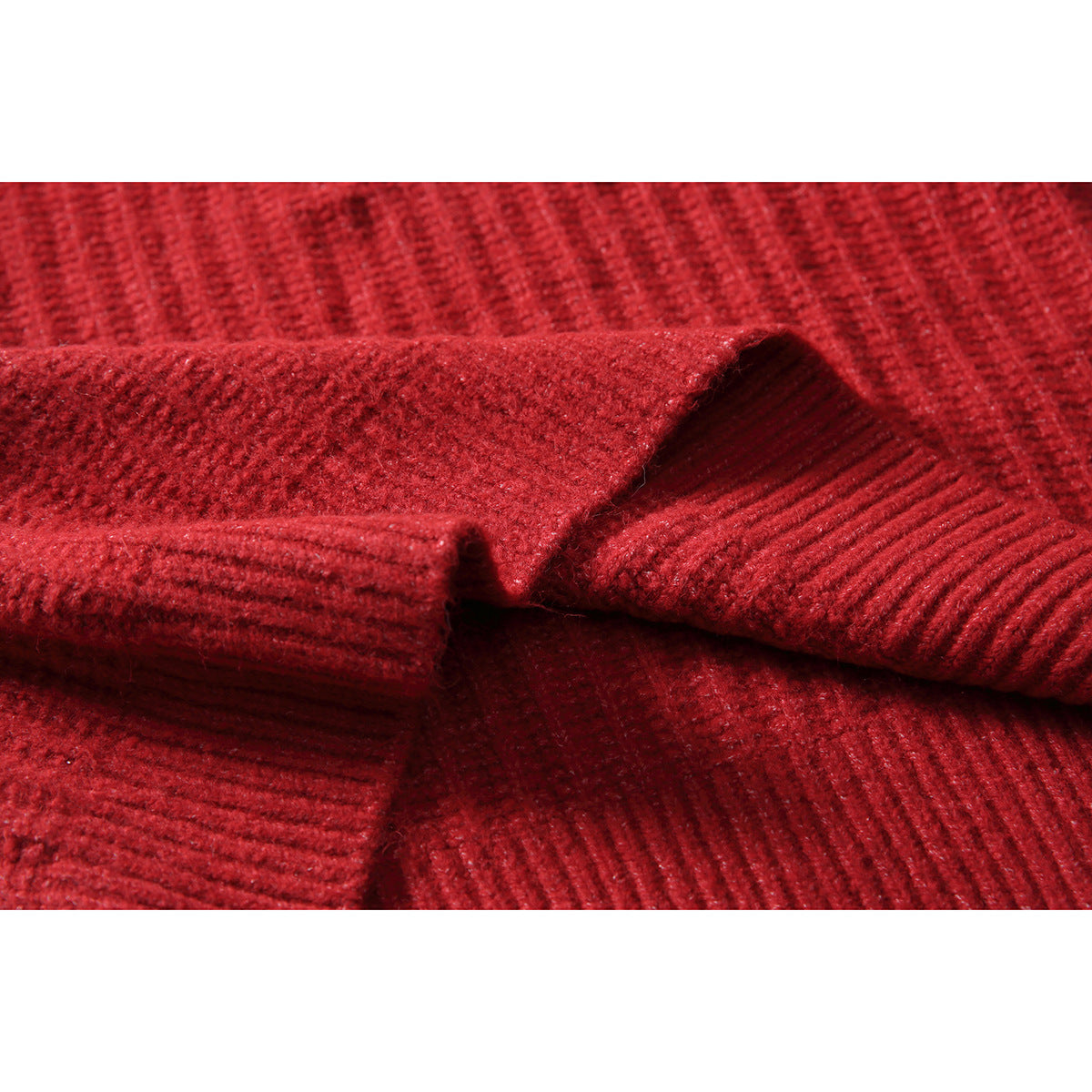 Close-up of the red sweater's ribbed knit and folded collar detail.