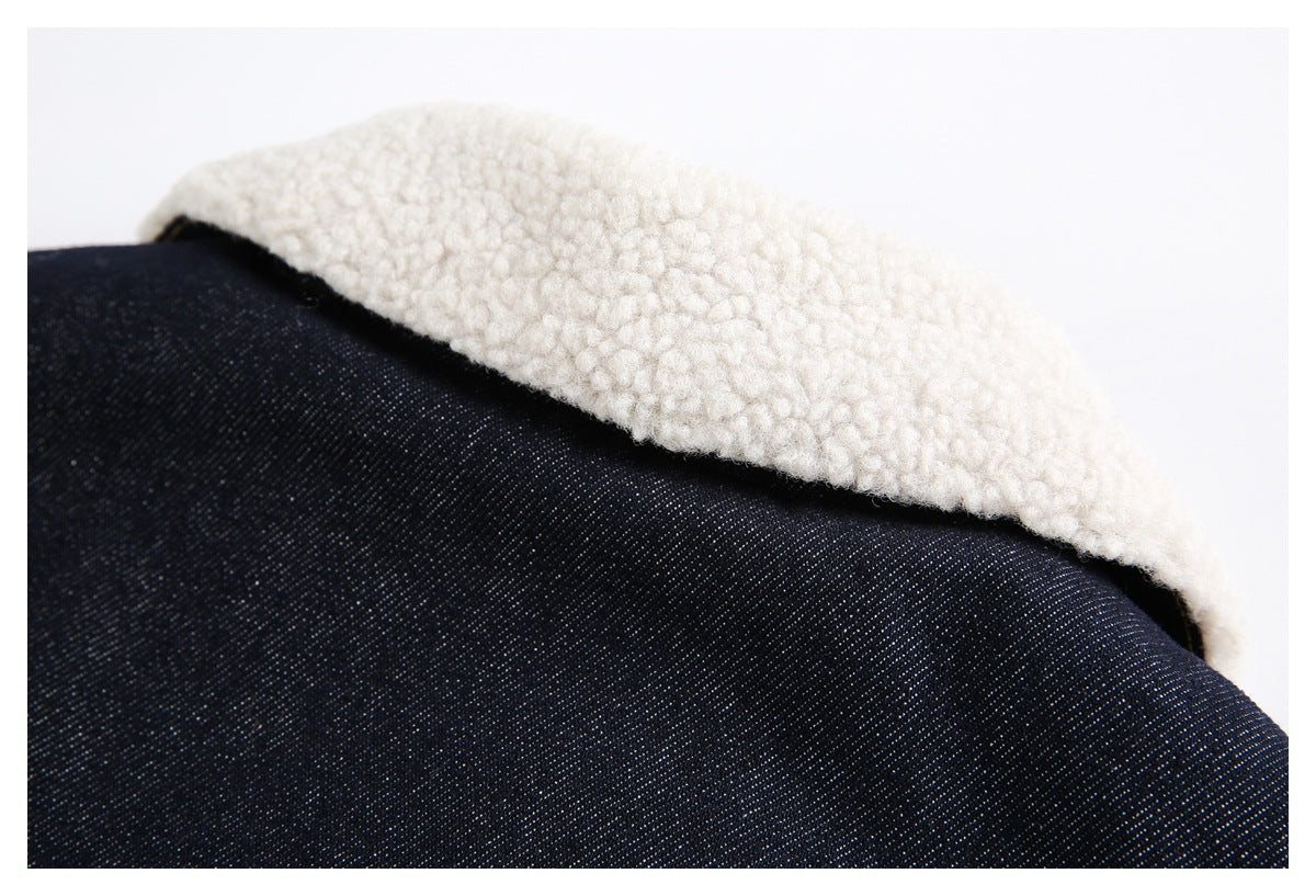 Close-up of cream sherpa lining folded over dark indigo denim.