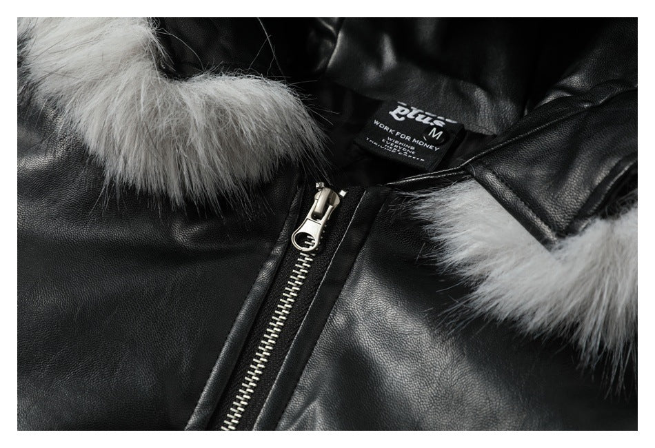 Close-up of the jacket's inner label, silver zipper, black material, and gray fur trim.