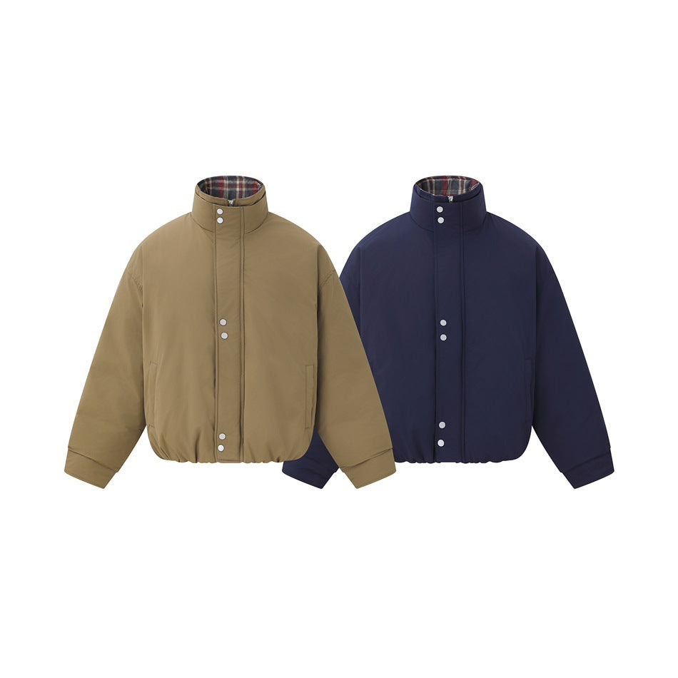 Front views of two high-collar jackets in tan and navy, with plaid collar lining, snap plackets, and elastic hems.