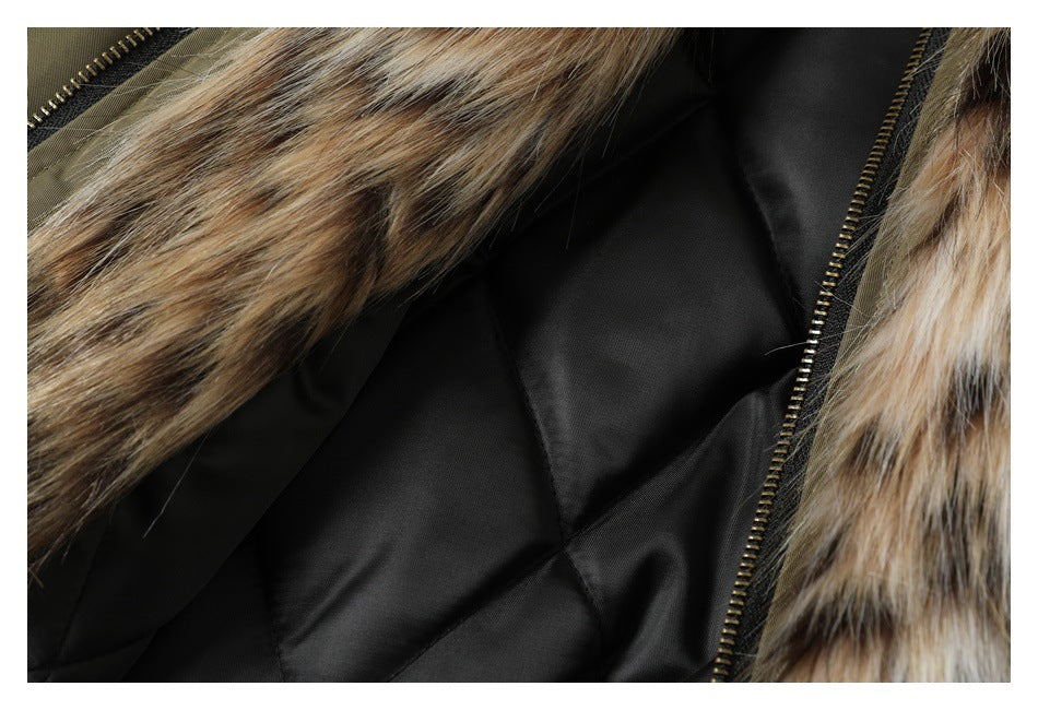 Close-up of a black quilted coat lining, faux-fur trim, and brass-tone zipper.