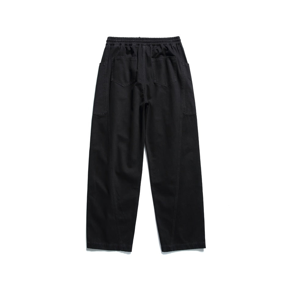 Black wide-leg pants back view with two patch back pockets and elastic waistband, flat lay