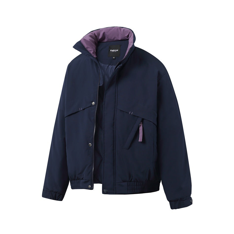 Navy padded jacket with zip partly open, showing purple collar lining, snap placket and purple pull tab