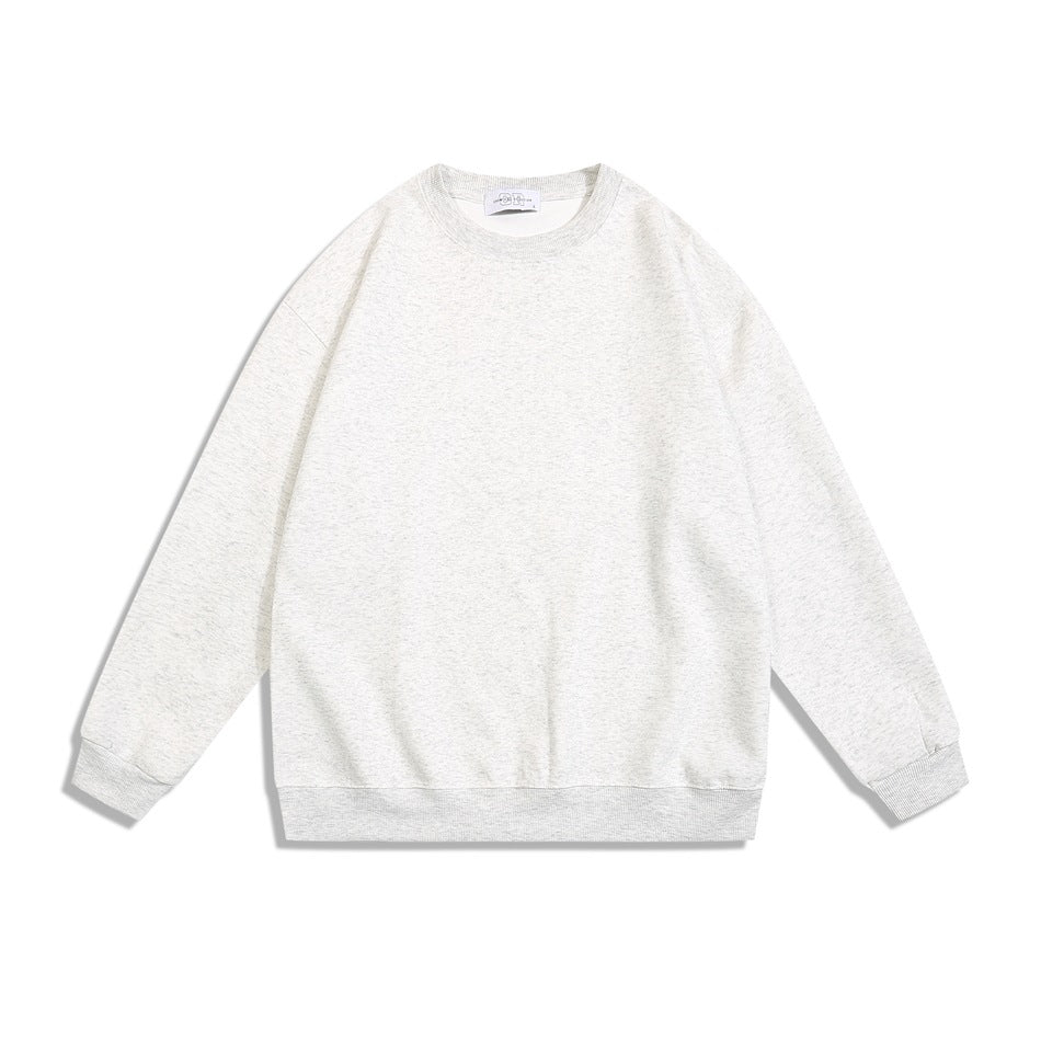 Heather gray speckled crew neck sweatshirt flat lay, front view, with ribbed trim
