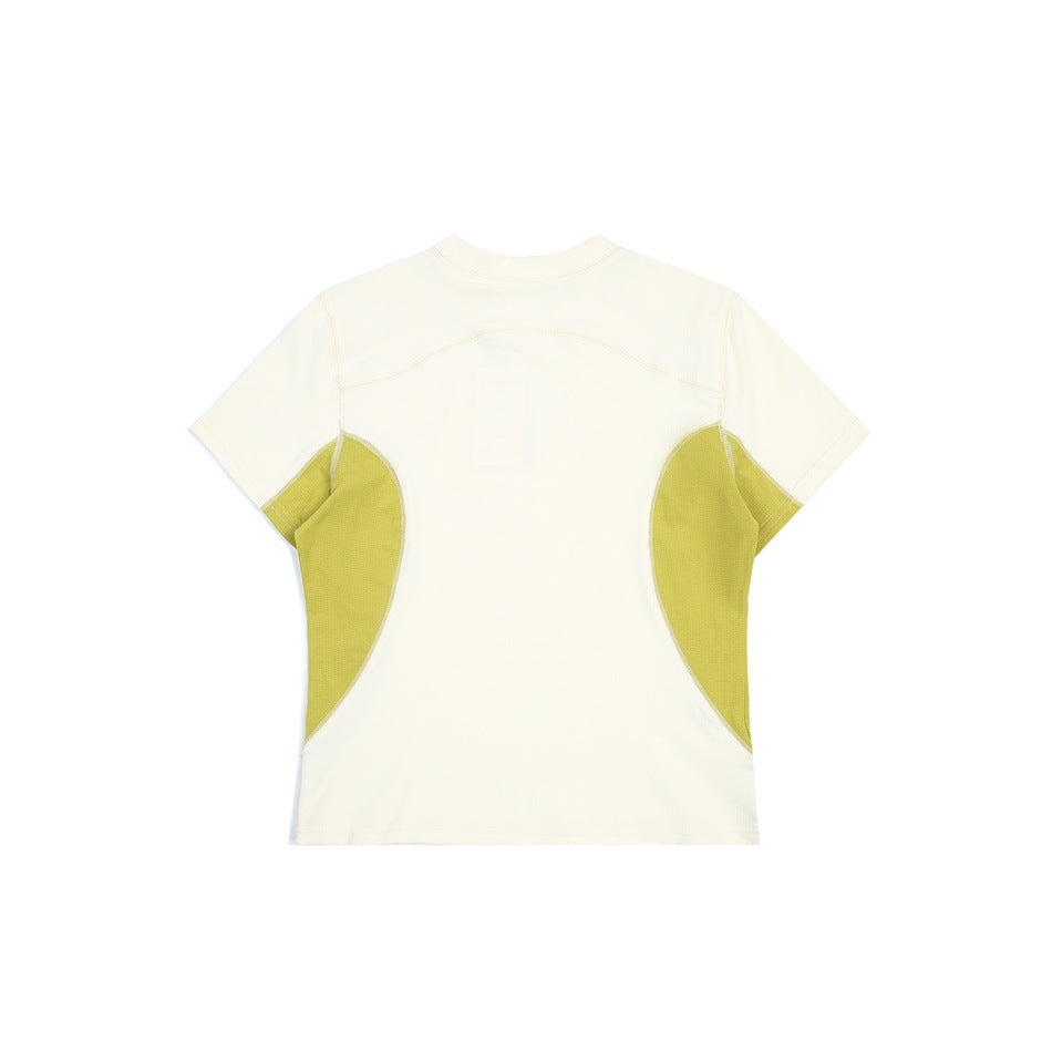 Back view of an ivory short-sleeve crew-neck T-shirt with olive yellow-green curved side panels and a curved upper-back seam.