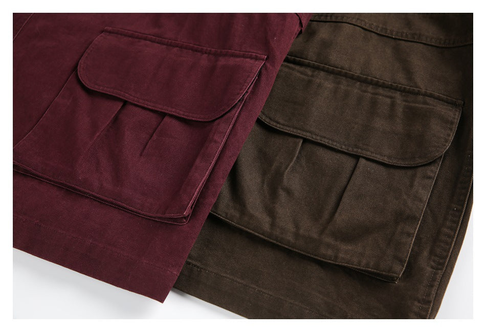Close-up of large flap pockets on burgundy and brown jackets.