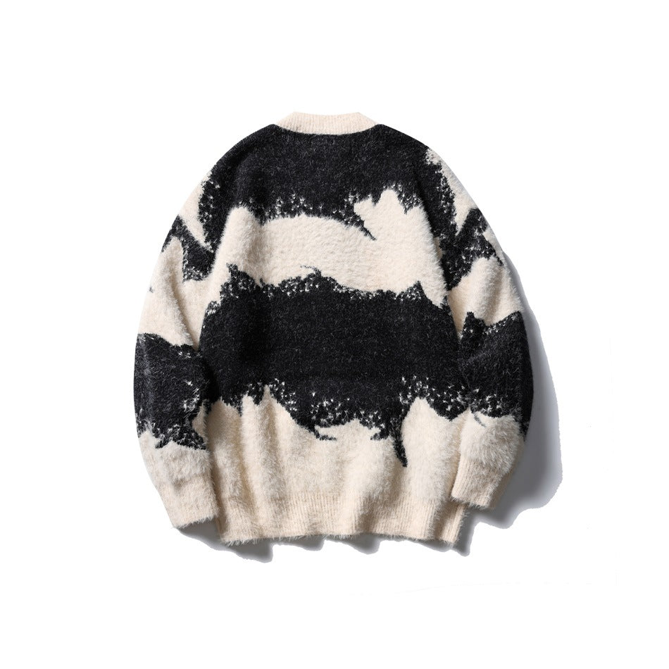 Back view of black and cream abstract-pattern fuzzy knit cardigan with ribbed hem and cuffs, flat lay