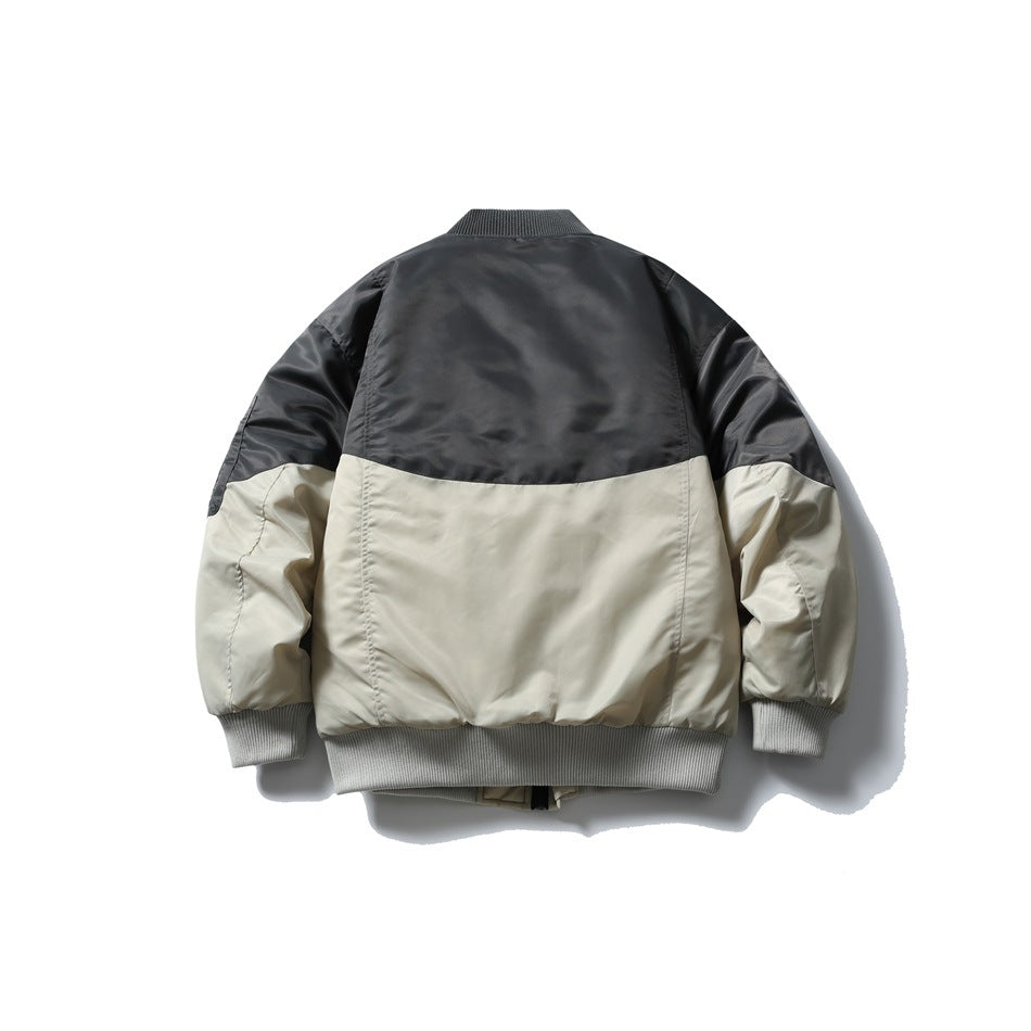Back view of a black and light gray color-block bomber jacket with ribbed cuffs and hem.