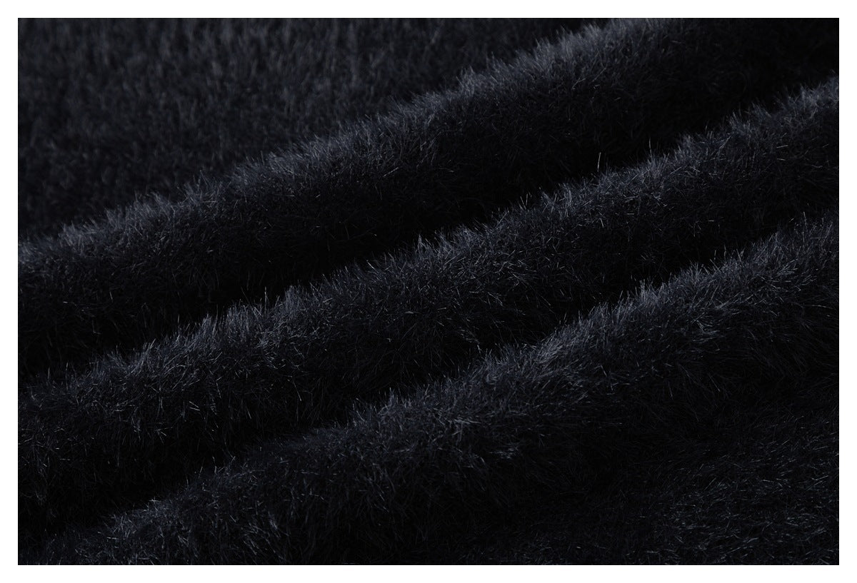 Macro view of the plush, fuzzy texture of black fabric.