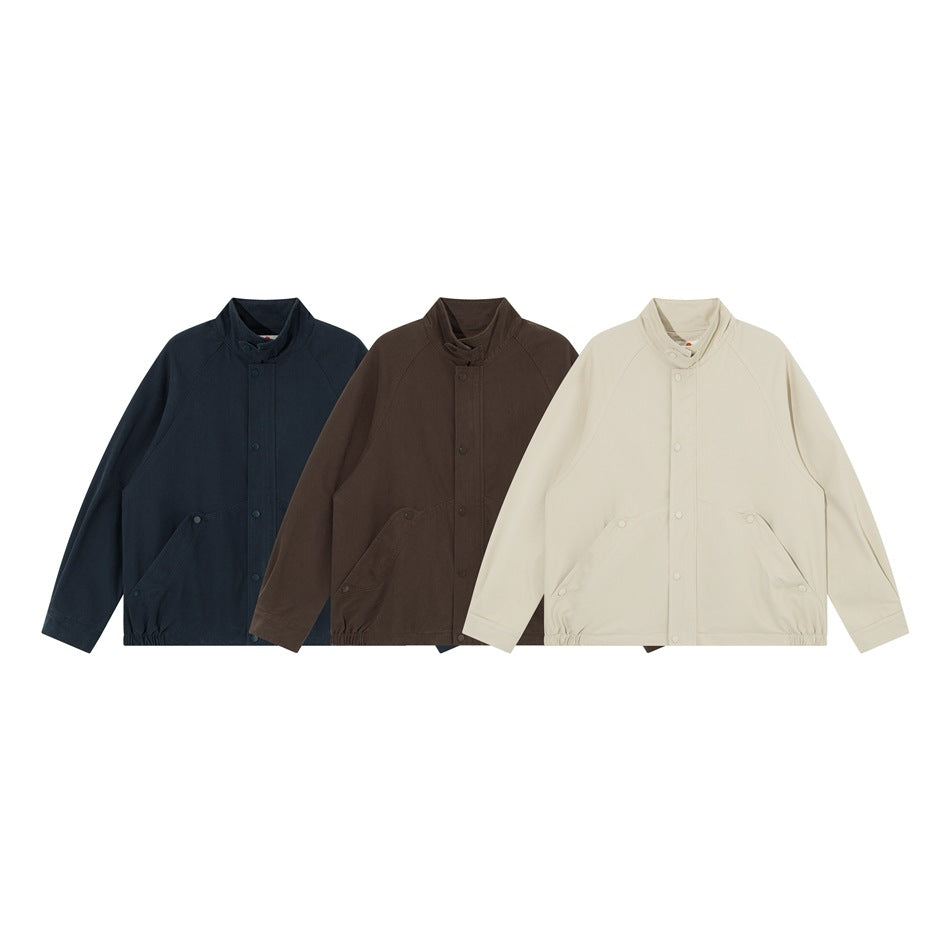 Three front views of a snap-front jacket in navy, dark brown, and ivory.