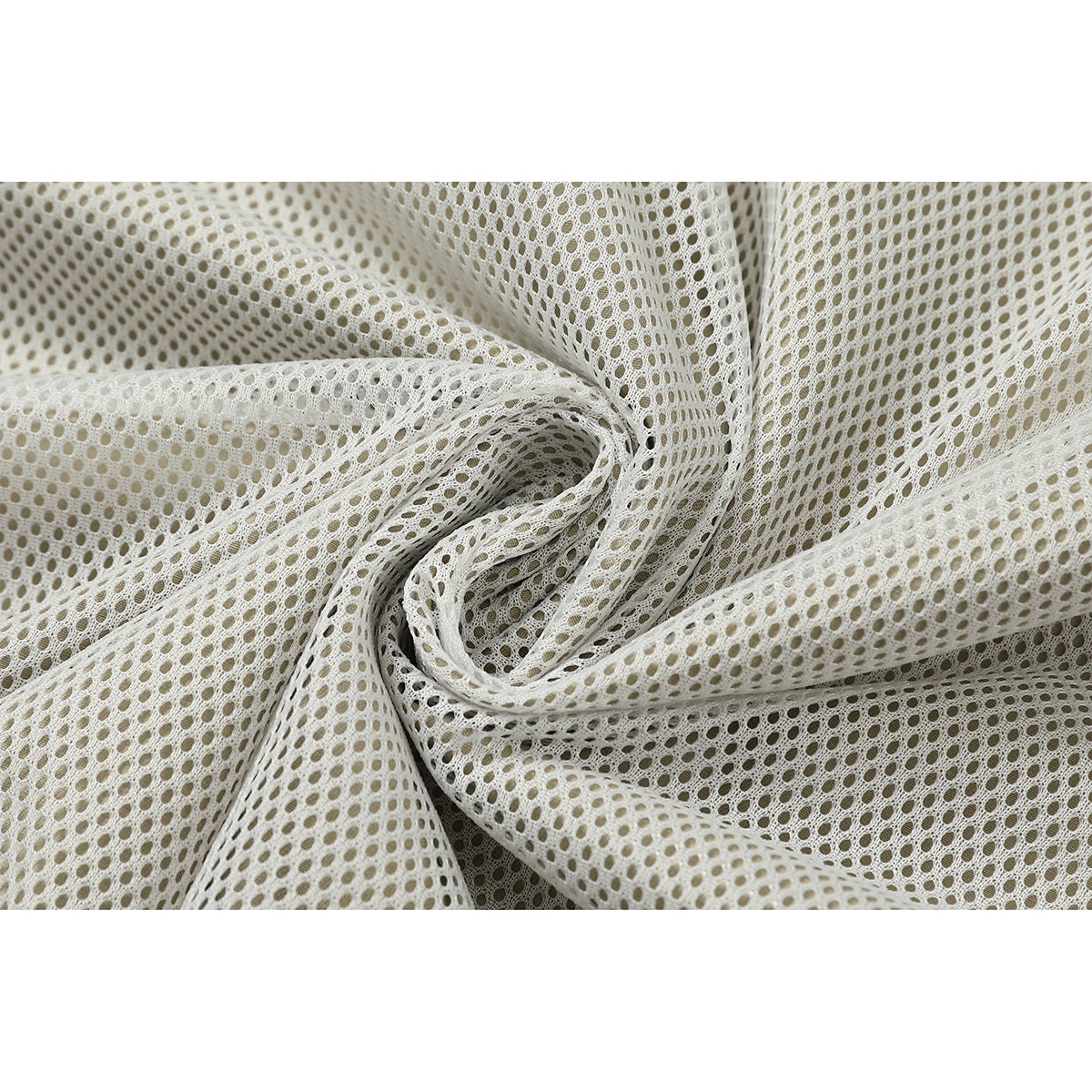 Close-up of white open-knit mesh fabric gathered into folds.