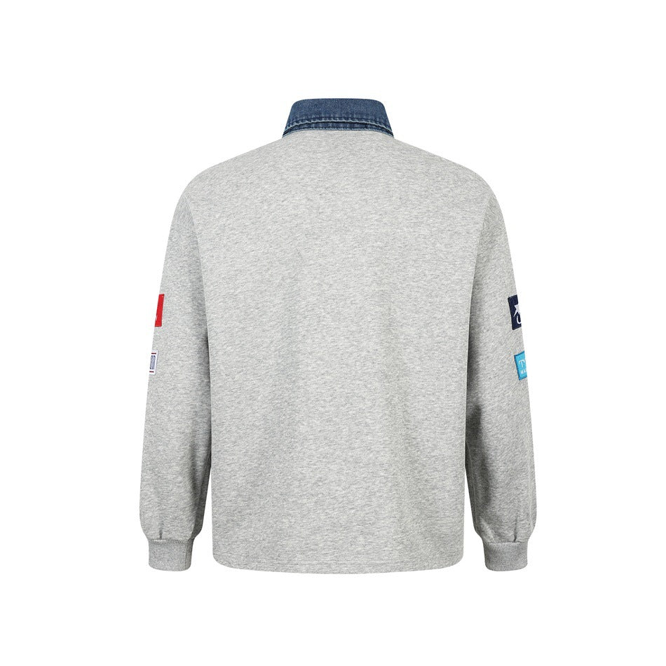 Back view of heather gray pullover with blue denim-look collar, ribbed cuffs and small sleeve patches