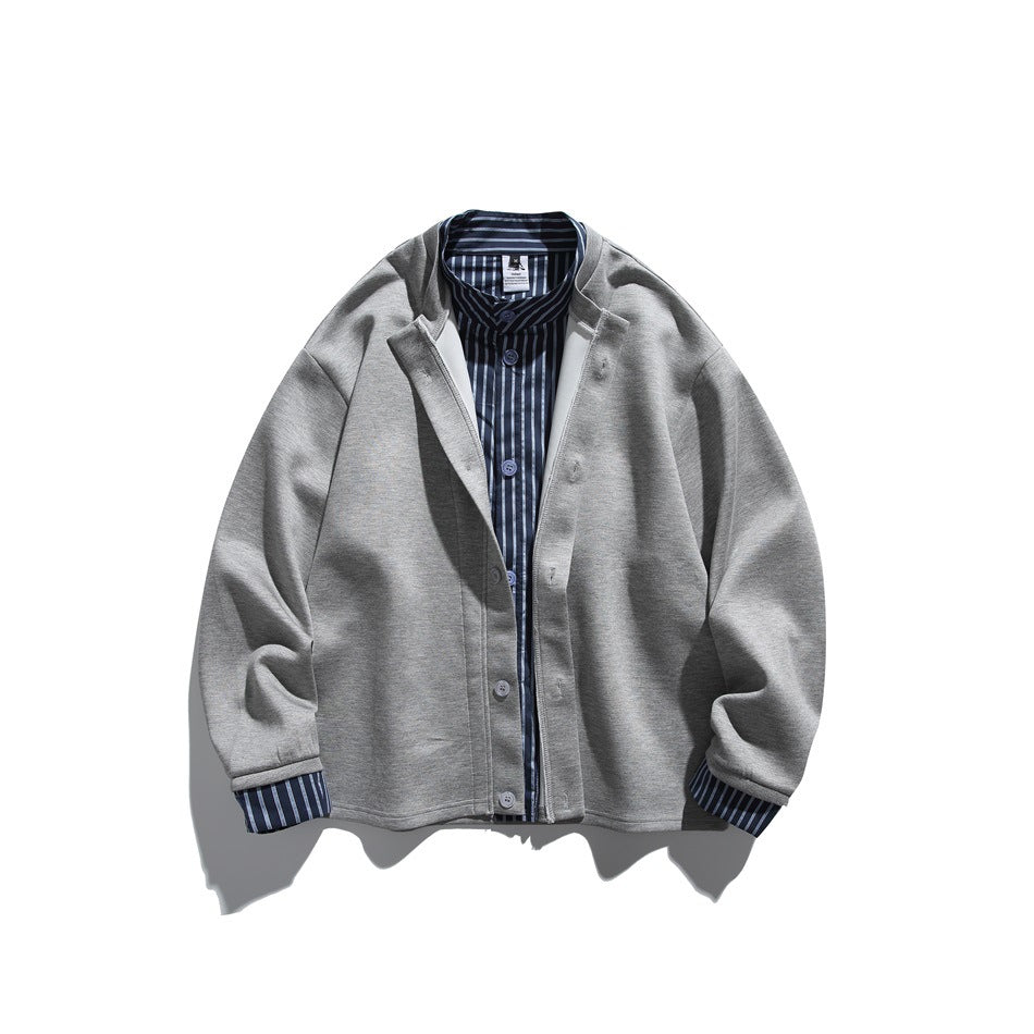 Gray button-front jacket with stand collar and blue-and-white striped layered collar and cuffs, flat lay