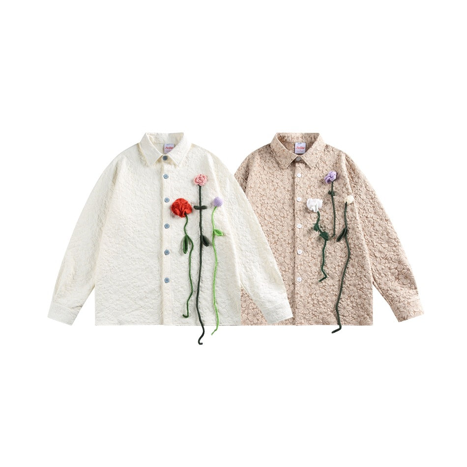 Cream and beige button-front jackets displayed side by side, each decorated with colorful flower appliqués.
