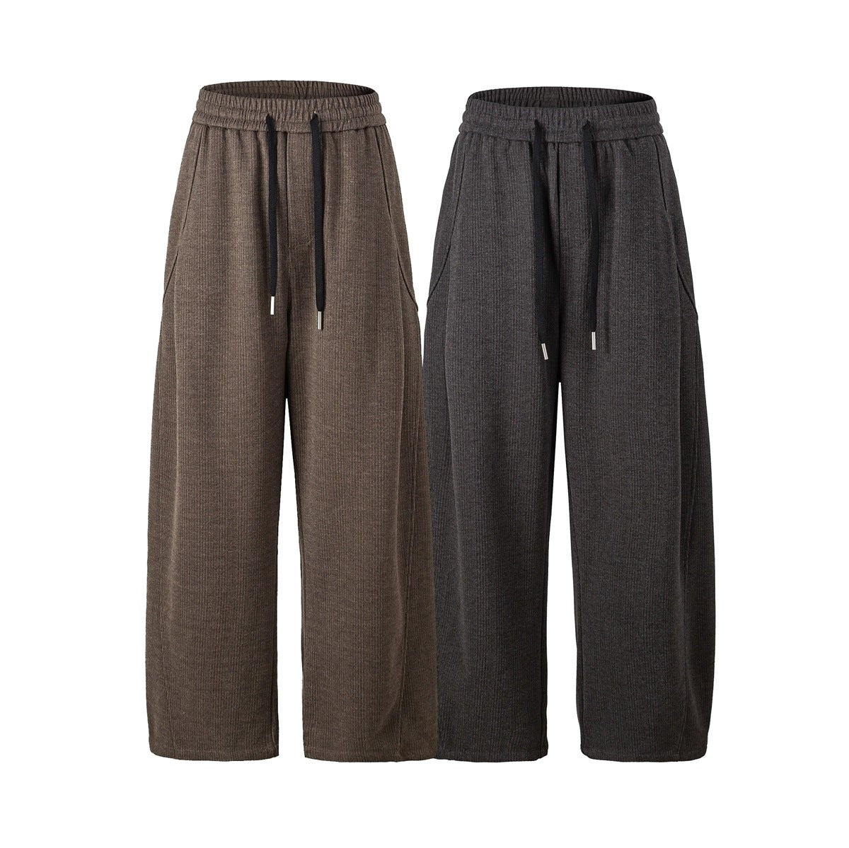 Front view of wide-leg trousers in brown and charcoal, with elastic drawstring waists and side pockets.
