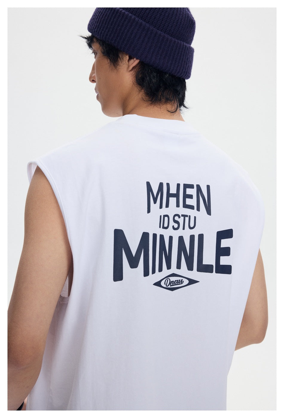 Close-up of the large dark graphic printed on the back of a white sleeveless shirt.