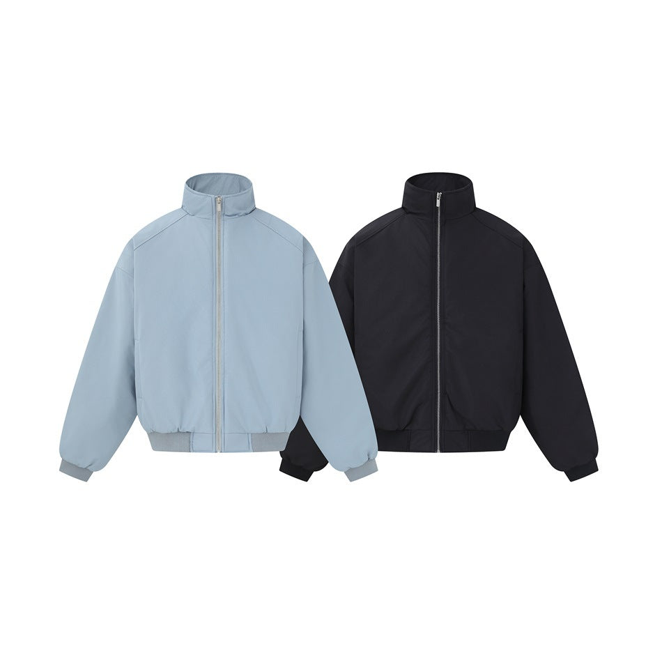Gray-blue and black stand-collar zip bomber-style jackets displayed side by side