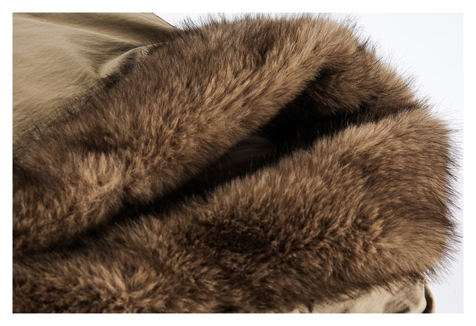 Close-up of the jacket’s thick, plush brown collar against its tan body.