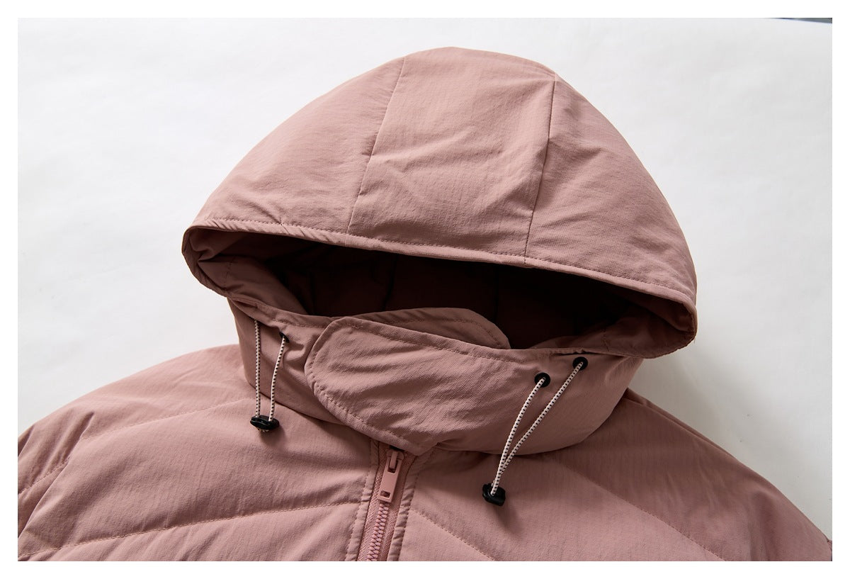 Close-up of a dusty pink jacket hood with adjustable drawcords and a high zippered collar.