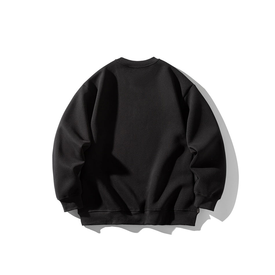Back view of a plain black crewneck sweatshirt laid flat against a white background.