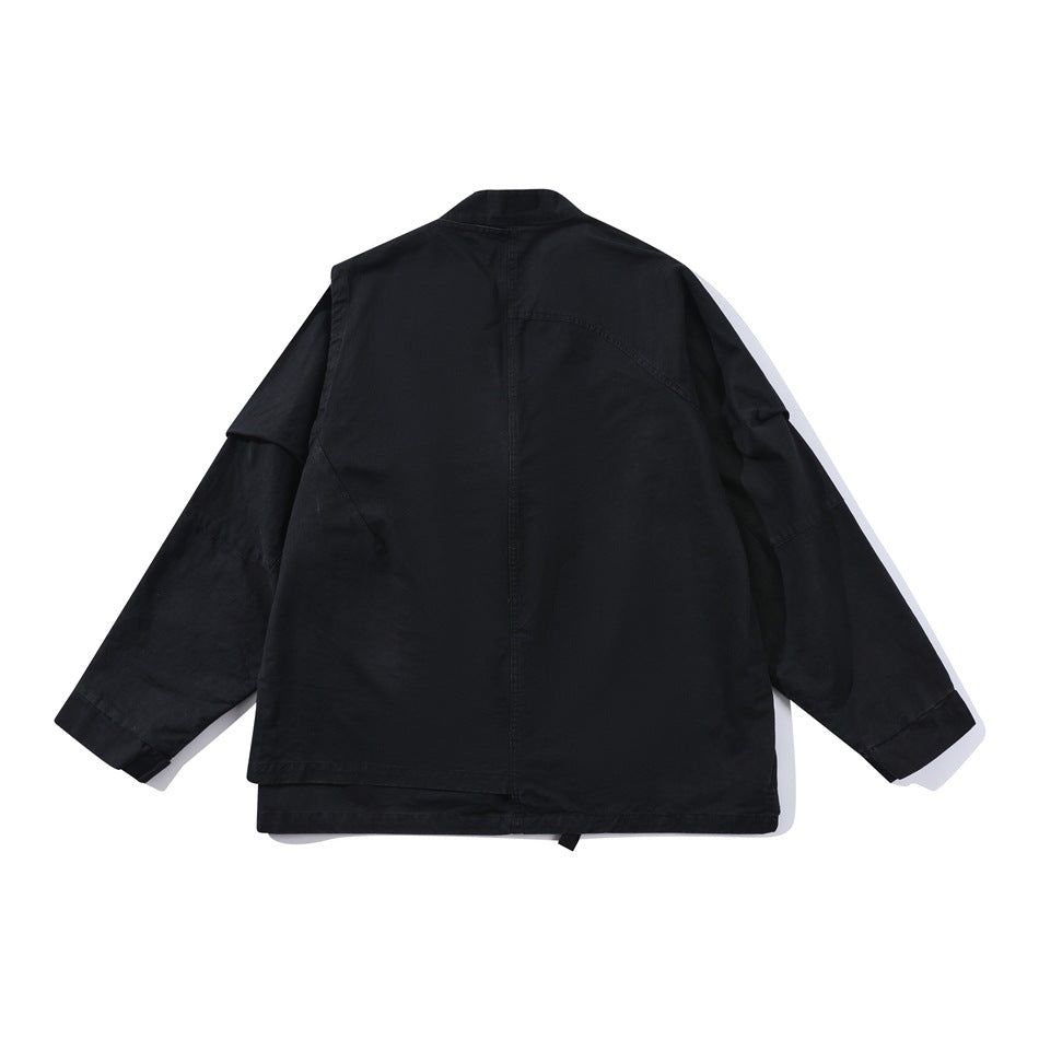 Back view of black jacket flat lay with center back seam, angled panel seams and layered hem