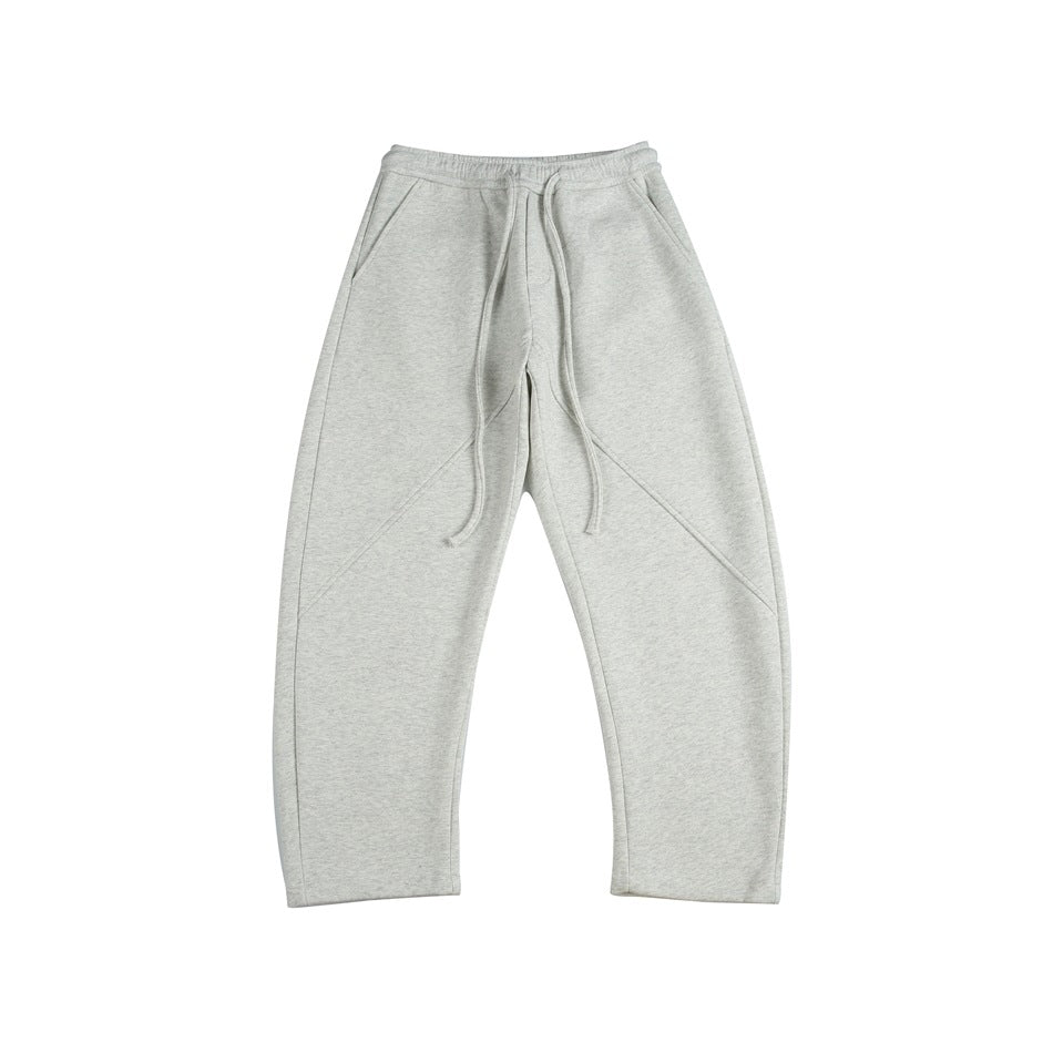Heather gray drawstring sweatpants with slanted pockets and diagonal front seams, flat lay, front view