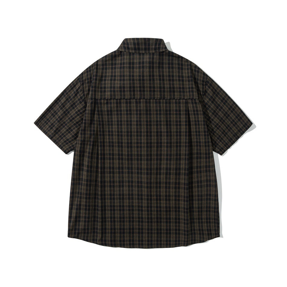 Back view of a dark brown and black plaid short-sleeve button-up shirt with a horizontal yoke seam.