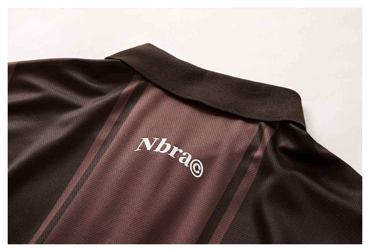 Close-up of the brown striped polo collar and small white chest logo.