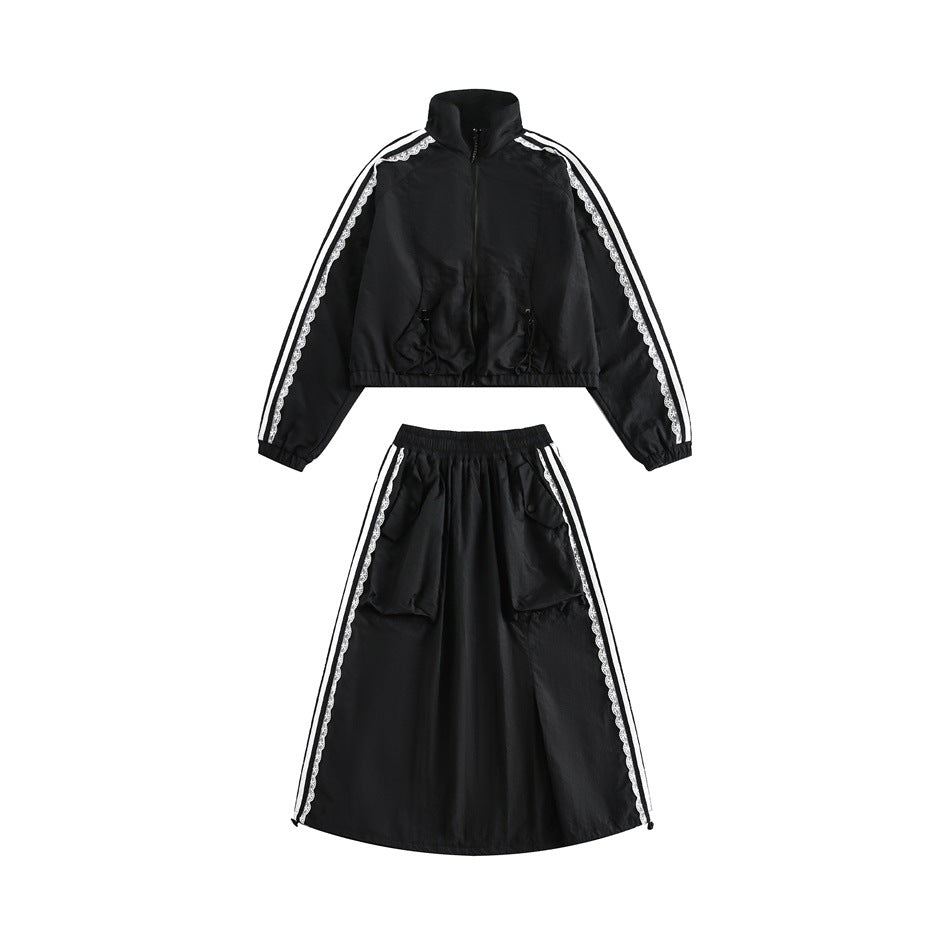 Black cropped zip jacket and long skirt with white lace-trimmed side stripes, shown as a two-piece set.