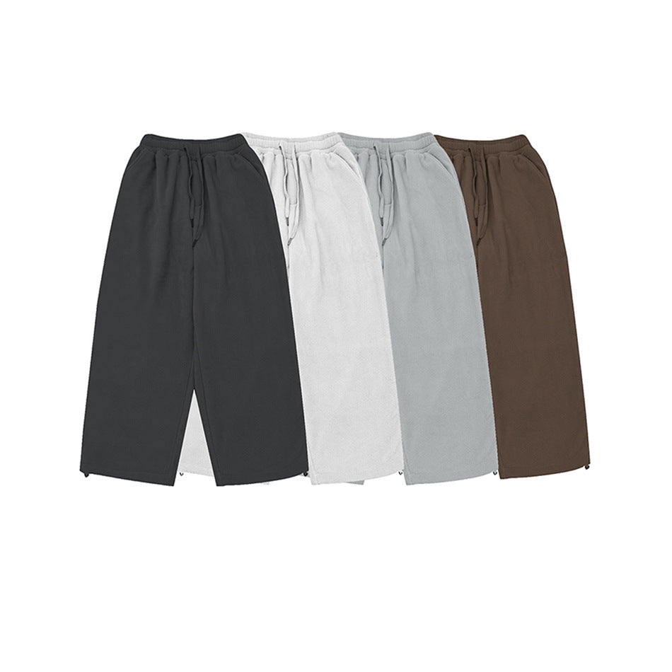 Four pairs of wide-leg drawstring pants shown together in black, white, light gray, and brown.