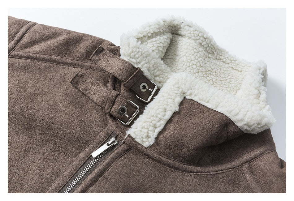 Close-up of a brown jacket with a cream sherpa collar, buckle straps, and a front zipper.