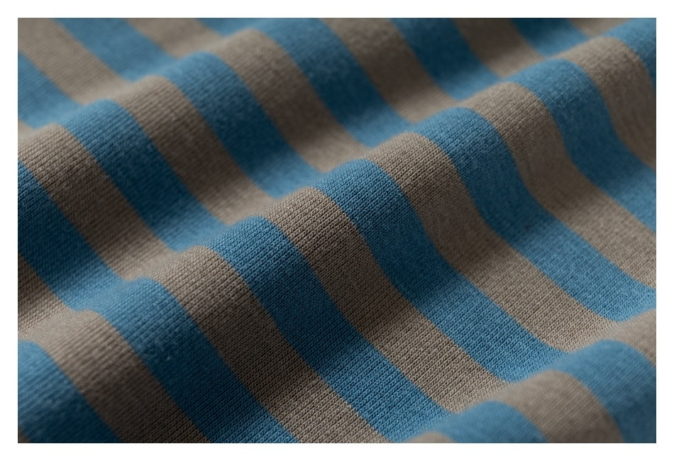 Macro view of the knit texture and blue and taupe stripes on a garment.