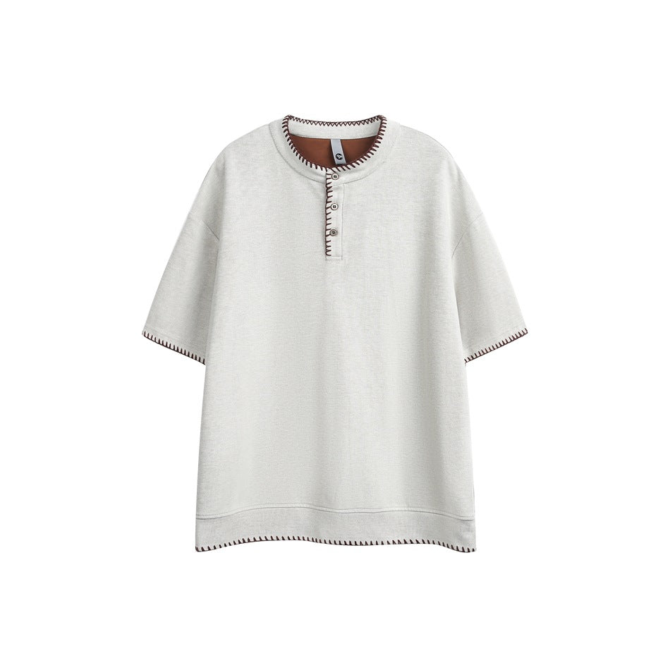 Beige-apricot short-sleeve Henley top with brown contrast whipstitch trim and brown inner neck facing