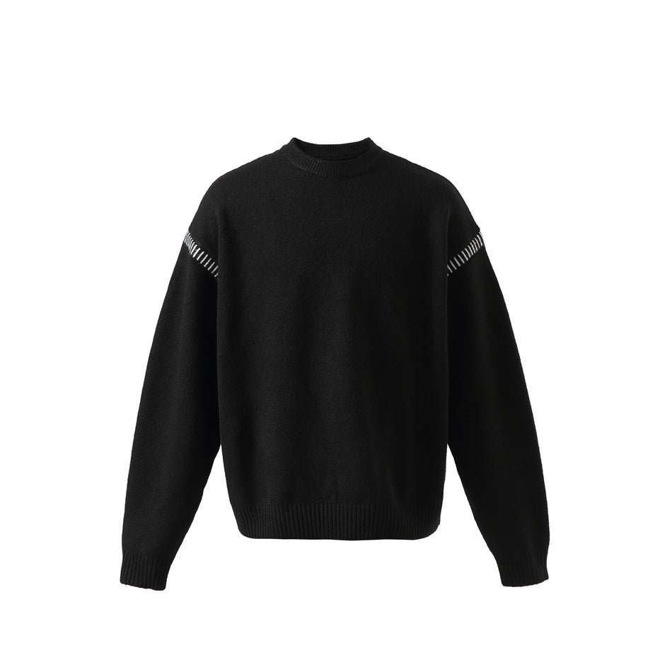 Black knit crewneck sweater, front view, with white contrast stitching along the upper sleeve seams