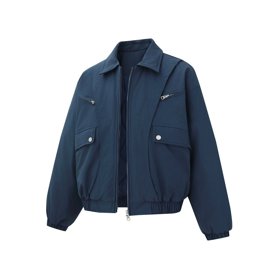 Gray-blue bomber jacket at an angle with the zipper open, showing the quilted interior, zip pockets and flap pockets