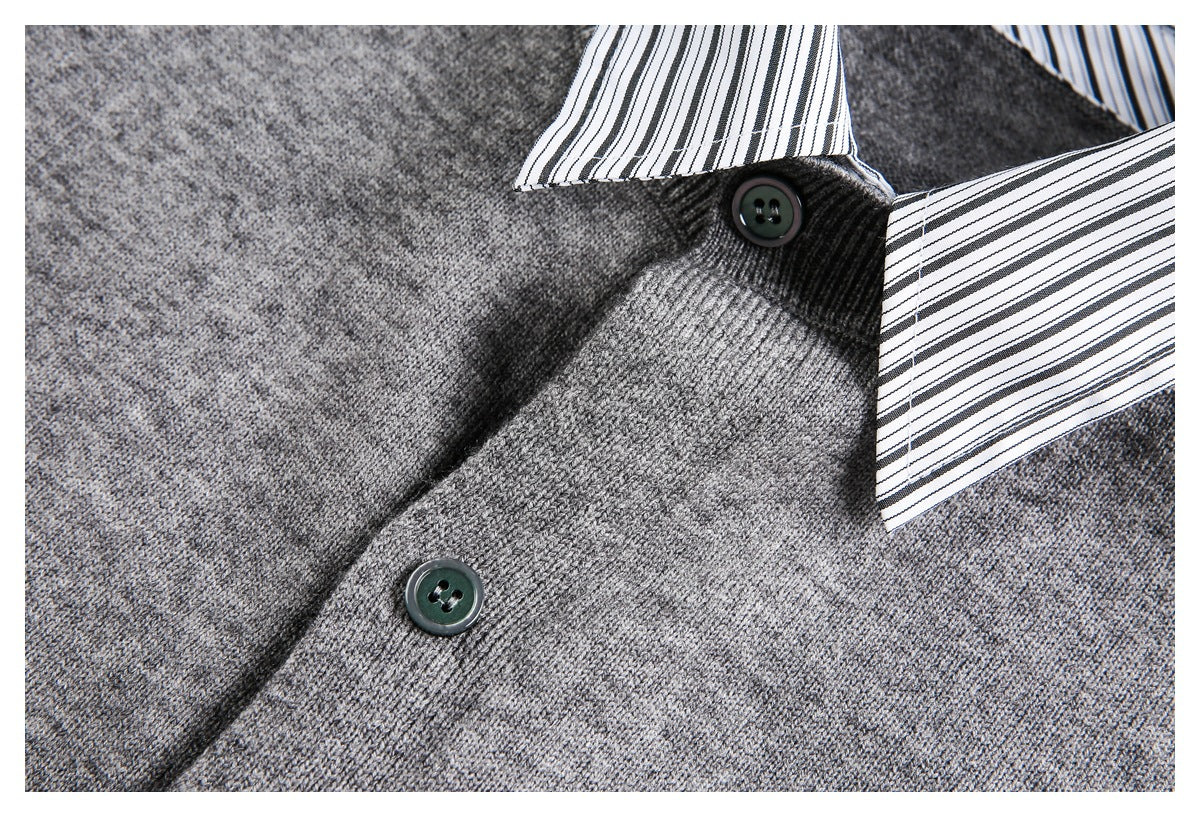 Close-up of a gray knit sweater's striped collar, dark buttons, and front placket.