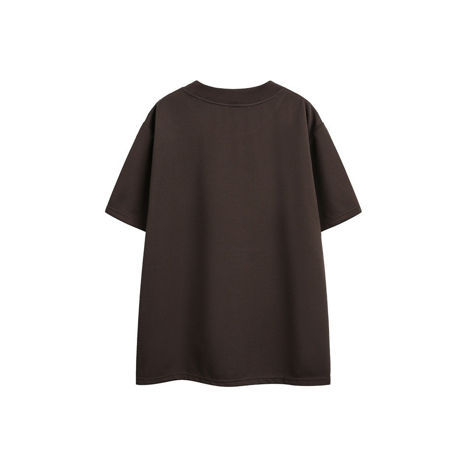 Back view of a dark brown short-sleeve T-shirt with a crew neck and textured surface.