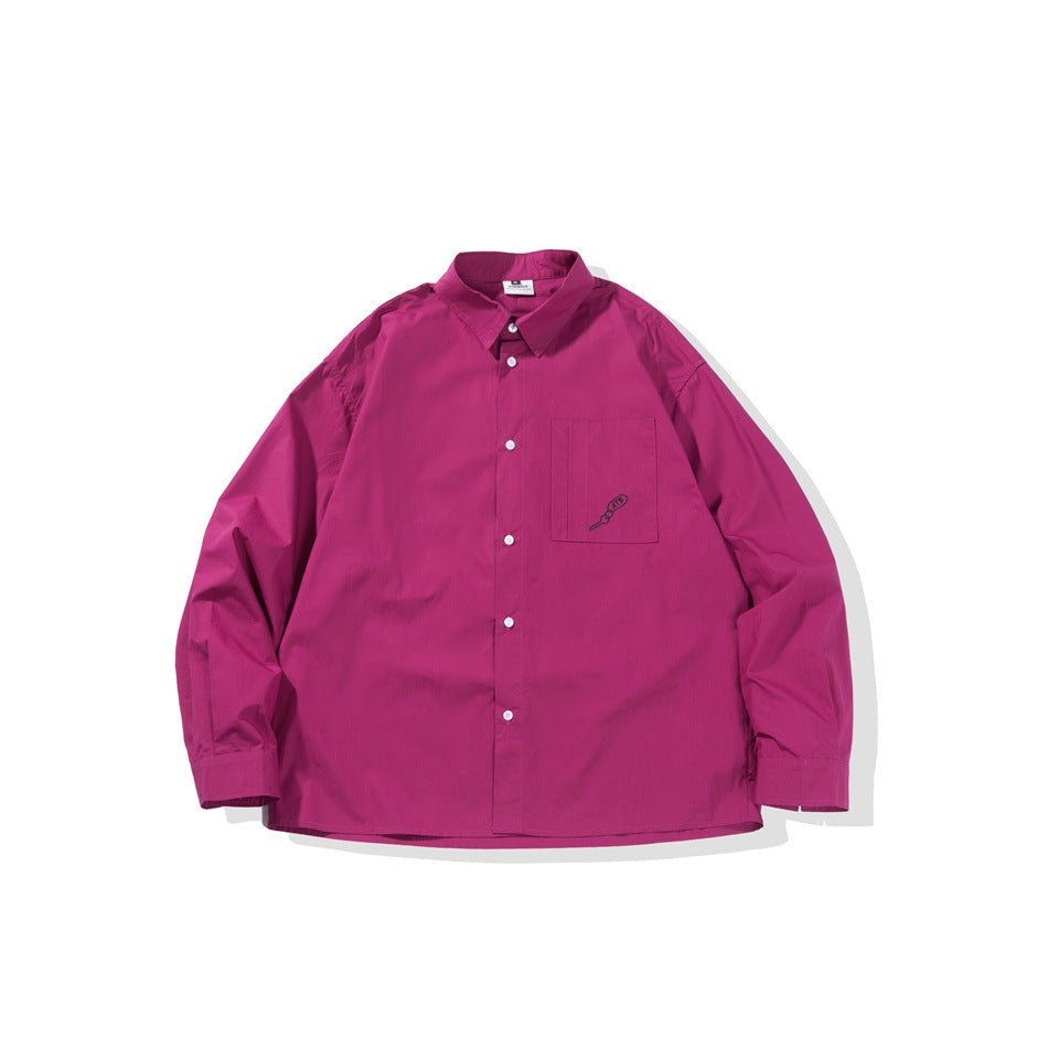 Magenta long-sleeve button-front shirt flat lay with chest pocket and small dark embroidered motif